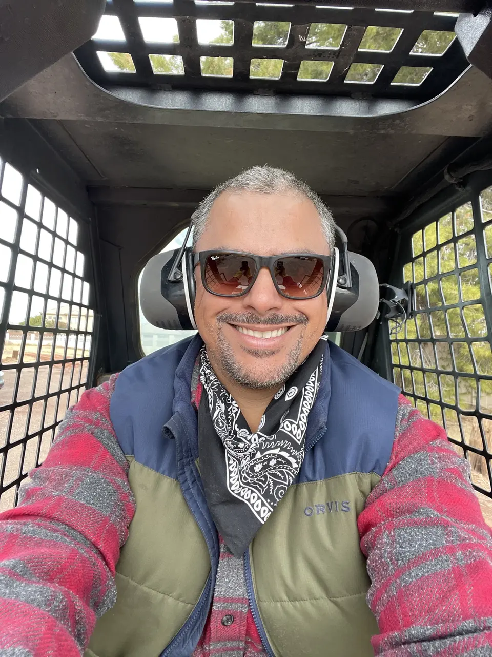 Roberto Juarez of Desert Dreamco LLC operating construction equipment in the Phoenix Valley