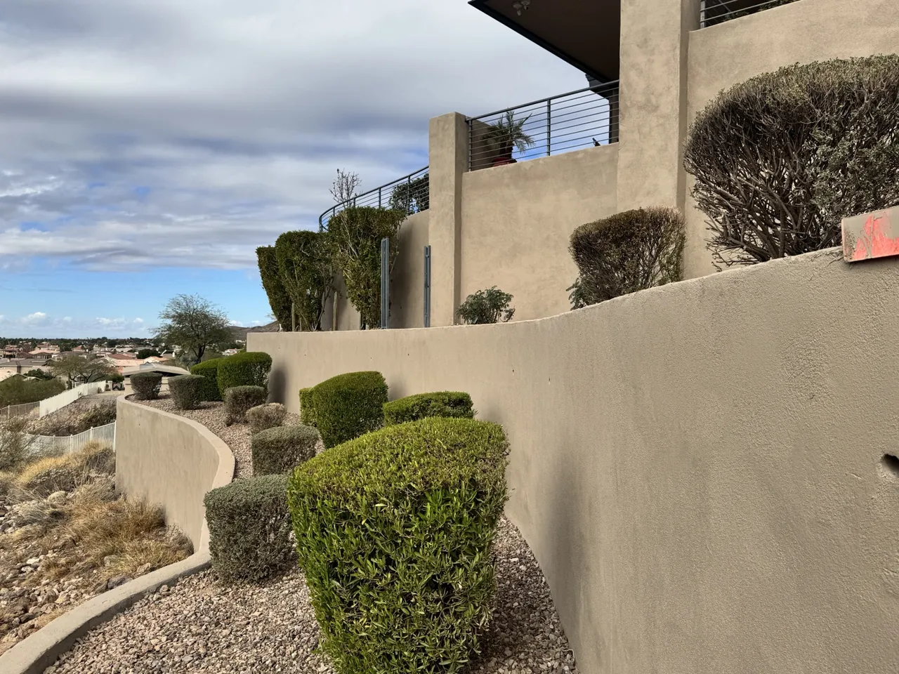 Restored stucco masonry wall after moisture-related finish damage in Arrowhead, Glendale, Arizona
