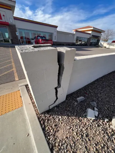 Vehicle-damaged block wall in Gilbert AZ before repair